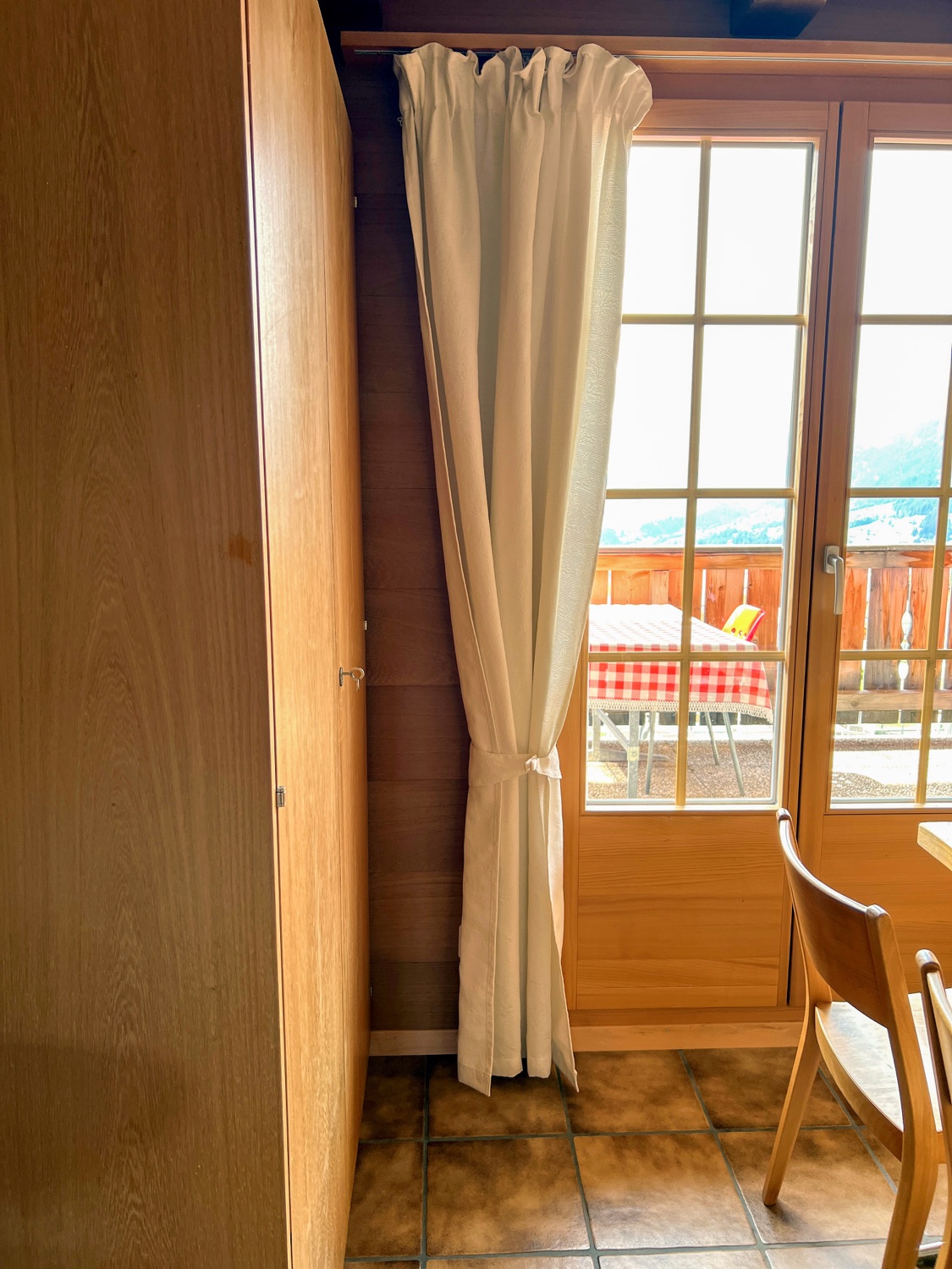 Table by the window with balcony access